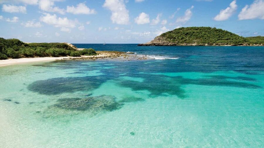 From St John's: Half Moon Bay Beach Half-Day Trip by Van - The short shoreline walk to calmer water